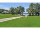 Beautiful community park featuring green lawns, walking paths, a gazebo, and lake access at 110 Todd Dr, Casselberry, FL 32707
