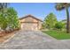 Beautiful home with a two-car garage, stone accents, lush lawn, and mature landscaping, creating a serene curb appeal at 110 Todd Dr, Casselberry, FL 32707
