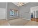 Cozy living room featuring neutral tones, a window offering natural light, and minimalist shelving at 110 Todd Dr, Casselberry, FL 32707
