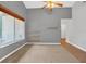 Bright living room with a window and minimalist shelving, showcasing natural light and a spacious feel at 110 Todd Dr, Casselberry, FL 32707