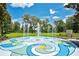 Vibrant water fountain in a community park with green grass, trees, and blue sky at 110 Todd Dr, Casselberry, FL 32707