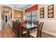 Elegant dining room featuring a large wood table and decorative wall art at 1164 Castle Pines Ct, Reunion, FL 34747