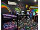 Themed room featuring bunk beds and an assortment of classic video game arcade machines at 1164 Castle Pines Ct, Reunion, FL 34747