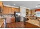 Kitchen with stainless steel appliances, granite countertops, and hardwood floors at 1164 Castle Pines Ct, Reunion, FL 34747