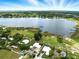 Beautiful aerial view of homes near a lake and green spaces offering a serene setting at 130 Masterpiece Rd, Lake Wales, FL 33898
