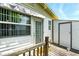 Backyard deck with an outdoor storage shed and white siding at 130 Masterpiece Rd, Lake Wales, FL 33898