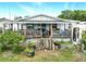 Home featuring an expansive back porch and yard, perfect for outdoor living at 130 Masterpiece Rd, Lake Wales, FL 33898