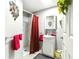 Cozy bathroom with a walk-in shower, vanity sink, and decorative flower hanging at 130 Masterpiece Rd, Lake Wales, FL 33898