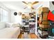 Bedroom with a white bed, hardwood floors, shelving and plenty of closet space at 130 Masterpiece Rd, Lake Wales, FL 33898