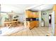 Kitchen featuring wood cabinets, tile floor, eat-in dining area, and outside access at 130 Masterpiece Rd, Lake Wales, FL 33898