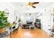 Comfortable living area with light-colored walls and vinyl floors adjacent to a workstation at 130 Masterpiece Rd, Lake Wales, FL 33898