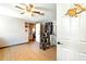 Bright room featuring a cat tree, wood flooring and ceiling fan at 130 Masterpiece Rd, Lake Wales, FL 33898
