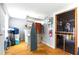 Ample storage with an ironing board, shelves, and storage area, utility meter, and fire extinguisher at 130 Masterpiece Rd, Lake Wales, FL 33898