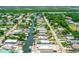 Aerial view of waterfront neighborhood with boat access to the ocean at 139 Douglas St, Edgewater, FL 32141
