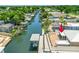 Waterfront property featuring a private boat dock, canal access, and brick patio for outdoor entertaining at 139 Douglas St, Edgewater, FL 32141