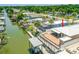 Waterfront home featuring a boat dock, brick patio, and easy access to nearby waterways at 139 Douglas St, Edgewater, FL 32141
