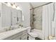 Bathroom featuring modern fixtures, white cabinets, and a shower-tub combo with tiled walls at 139 Douglas St, Edgewater, FL 32141