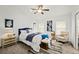 Bright bedroom featuring a ceiling fan, stylish decor, and lots of natural light from the windows at 139 Douglas St, Edgewater, FL 32141