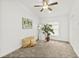 Bright bedroom with fan, carpet, large window, decor, and a plant at 139 Douglas St, Edgewater, FL 32141