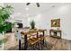 Open concept dining area features modern table and seating, adjacent to a well-equipped kitchen at 139 Douglas St, Edgewater, FL 32141