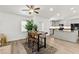 The dining area is well-lit, with a table and seating adjacent to the kitchen at 139 Douglas St, Edgewater, FL 32141