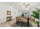 Open dining area with rustic table, seating, and stylish decor; bright, open space for entertaining or relaxed meals at 139 Douglas St, Edgewater, FL 32141