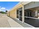 Home's exterior features a screened-in porch and patio with access to the backyard at 139 Douglas St, Edgewater, FL 32141