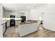 Modern kitchen with granite countertop island, flows into living space at 139 Douglas St, Edgewater, FL 32141
