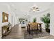 Bright living room with modern wood flooring, leading to an outdoor area, complemented by chic decorations and natural light at 139 Douglas St, Edgewater, FL 32141