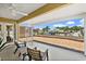 Covered and screened patio with canal view, chairs and table at 139 Douglas St, Edgewater, FL 32141