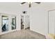 Room featuring an open layout, neutral paint, ceiling fan, french doors and carpet floors at 139 Douglas St, Edgewater, FL 32141
