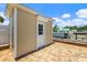 Exterior view of the backyard shed on brick deck with canal view at 139 Douglas St, Edgewater, FL 32141