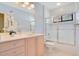 Bathroom showcasing a vanity with drawers and cabinets and a shower-tub combination at 1609 Glen Eagles Way, Orlando, FL 32804