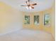 Spacious bedroom with three large windows and plush carpeting at 1609 Glen Eagles Way, Orlando, FL 32804