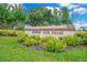 The community sign for Country Club Villas sits amongst the verdant landscaping at 1609 Glen Eagles Way, Orlando, FL 32804