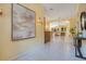 Bright foyer with decorative lighting, tile flooring, and a view into the open living spaces at 1609 Glen Eagles Way, Orlando, FL 32804
