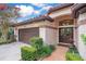 Welcoming front entrance featuring a brick walkway, a dark double door, and a well-manicured garden at 1609 Glen Eagles Way, Orlando, FL 32804