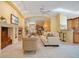 Open-concept living area with a fireplace, comfortable seating, and easy access to the kitchen at 1609 Glen Eagles Way, Orlando, FL 32804