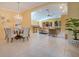 Spacious and bright living spaces featuring tile floors, chandelier, and views of the outdoor living spaces at 1609 Glen Eagles Way, Orlando, FL 32804
