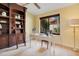 Home office offers built-in shelving, natural light from the window, and a neutral palette at 1609 Glen Eagles Way, Orlando, FL 32804