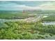 An aerial view of the community, showcasing its houses, lakes, and green spaces at 17426 Saw Palmetto Ave, Clermont, FL 34714