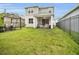 Back exterior view of a two-story home featuring a patio and spacious backyard at 17426 Saw Palmetto Ave, Clermont, FL 34714