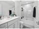 Clean bathroom with a glass-enclosed shower, single sink vanity, and modern fixtures at 17426 Saw Palmetto Ave, Clermont, FL 34714