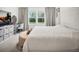 Cozy bedroom with a TV and large windows for natural light at 17426 Saw Palmetto Ave, Clermont, FL 34714