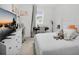 Bright bedroom featuring modern decor, large window and a plush bed at 17426 Saw Palmetto Ave, Clermont, FL 34714