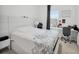 Cozy bedroom with natural light from the window and a streamlined workspace at 17426 Saw Palmetto Ave, Clermont, FL 34714