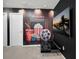 This bonus room features fun movie decor and a large flat screen TV at 17426 Saw Palmetto Ave, Clermont, FL 34714