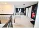 Spacious upstairs bonus room featuring comfortable seating and a movie-themed design at 17426 Saw Palmetto Ave, Clermont, FL 34714