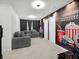 Bonus room with theater themed wallpaper, seating area and neutral carpeting at 17426 Saw Palmetto Ave, Clermont, FL 34714