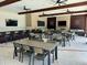 Spacious clubhouse featuring tables, chairs, and TVs for entertainment and social gatherings at 17426 Saw Palmetto Ave, Clermont, FL 34714